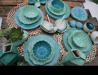 handmade porcelain dinnerware table stting in shades of teal, turquoise and aqua