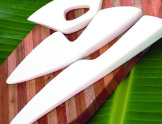 sculptural porcelain cheese knives in a set of 3  on a cheese board