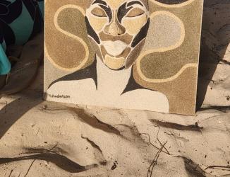Artwork titled Fugue, relief sculpture with sand finish in earth tones. The abstract face is sculpted and protrudes off the canvas, with the same beige and brown tones blending into the organic flowing background shapes. Textured 3D artwork by Taniki Anderson 